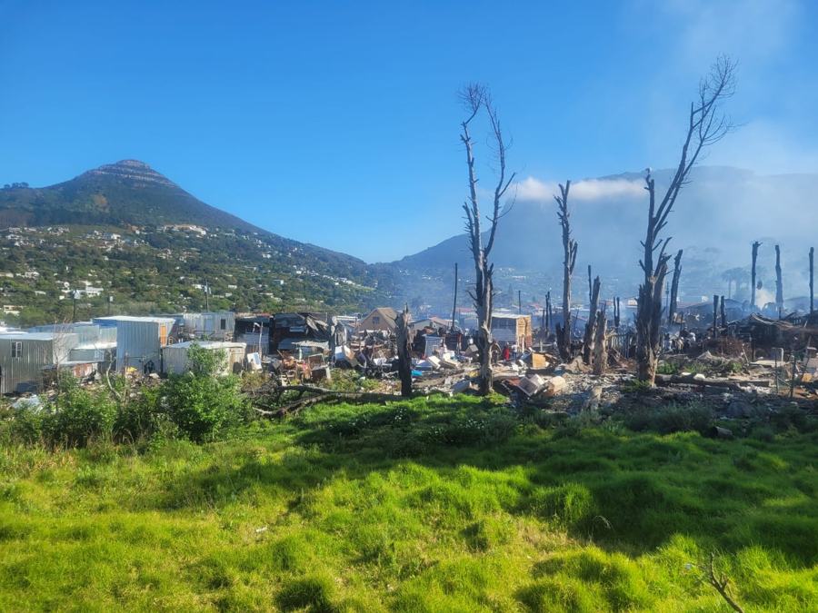 Scorched trees and cleared ground in Mayitshe